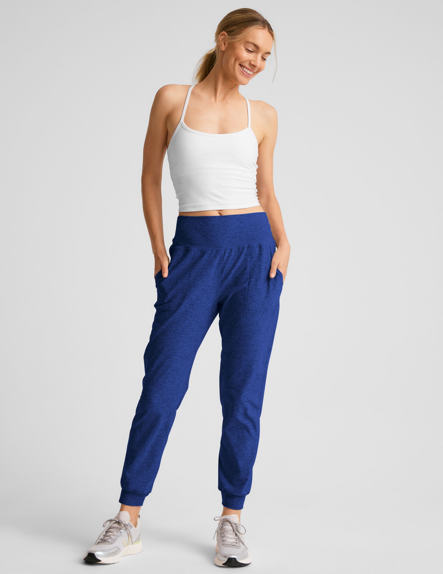 blue midi length joggers with side pockets. 