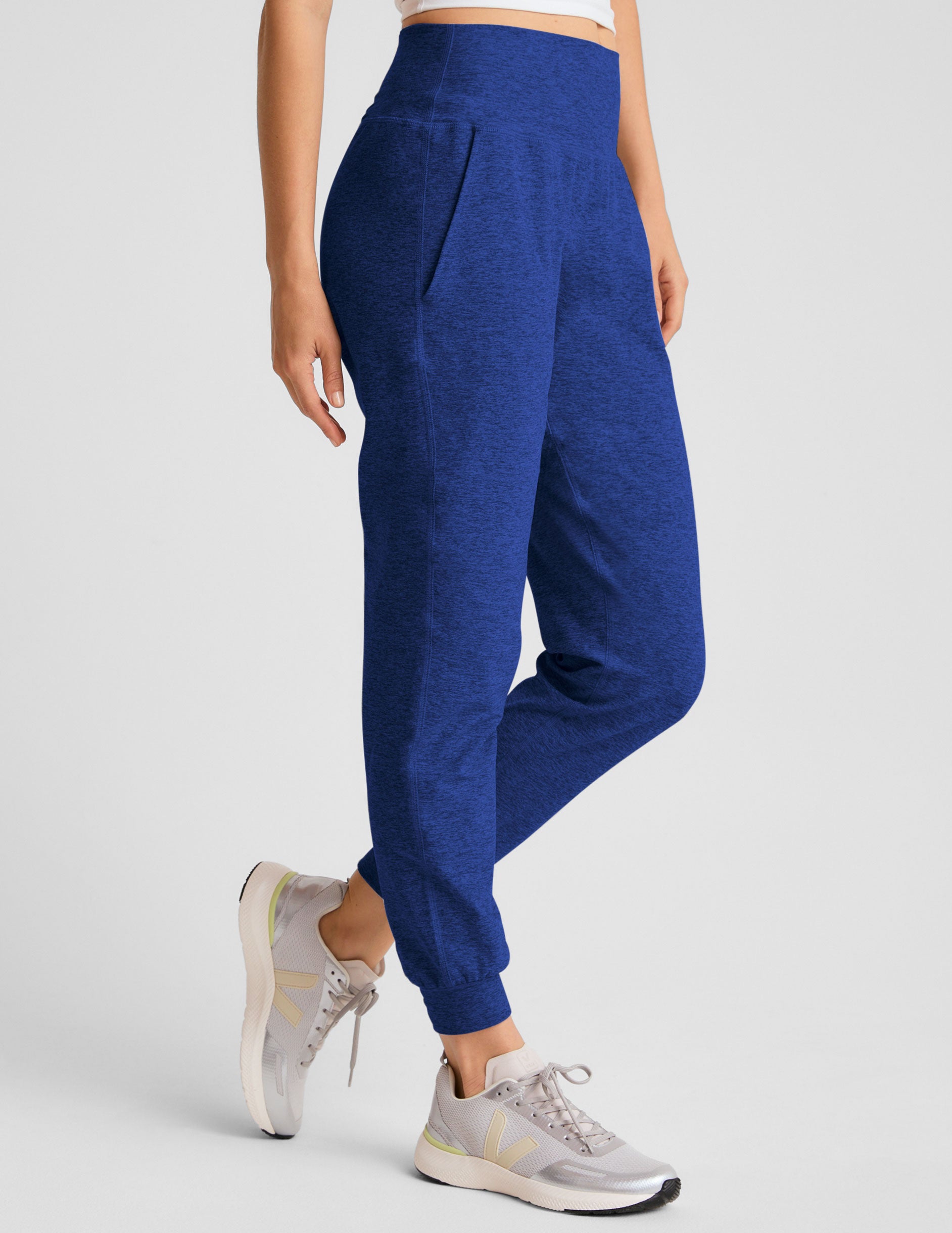 blue midi length joggers with side pockets. 