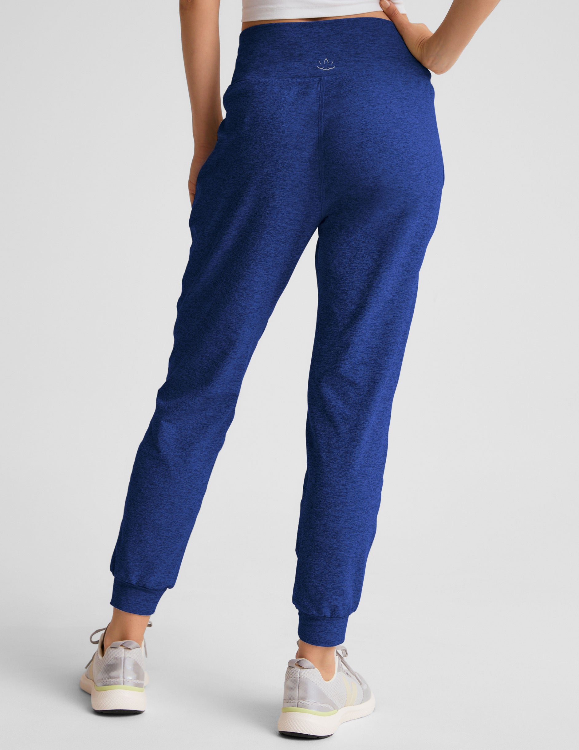 blue midi length joggers with side pockets. 