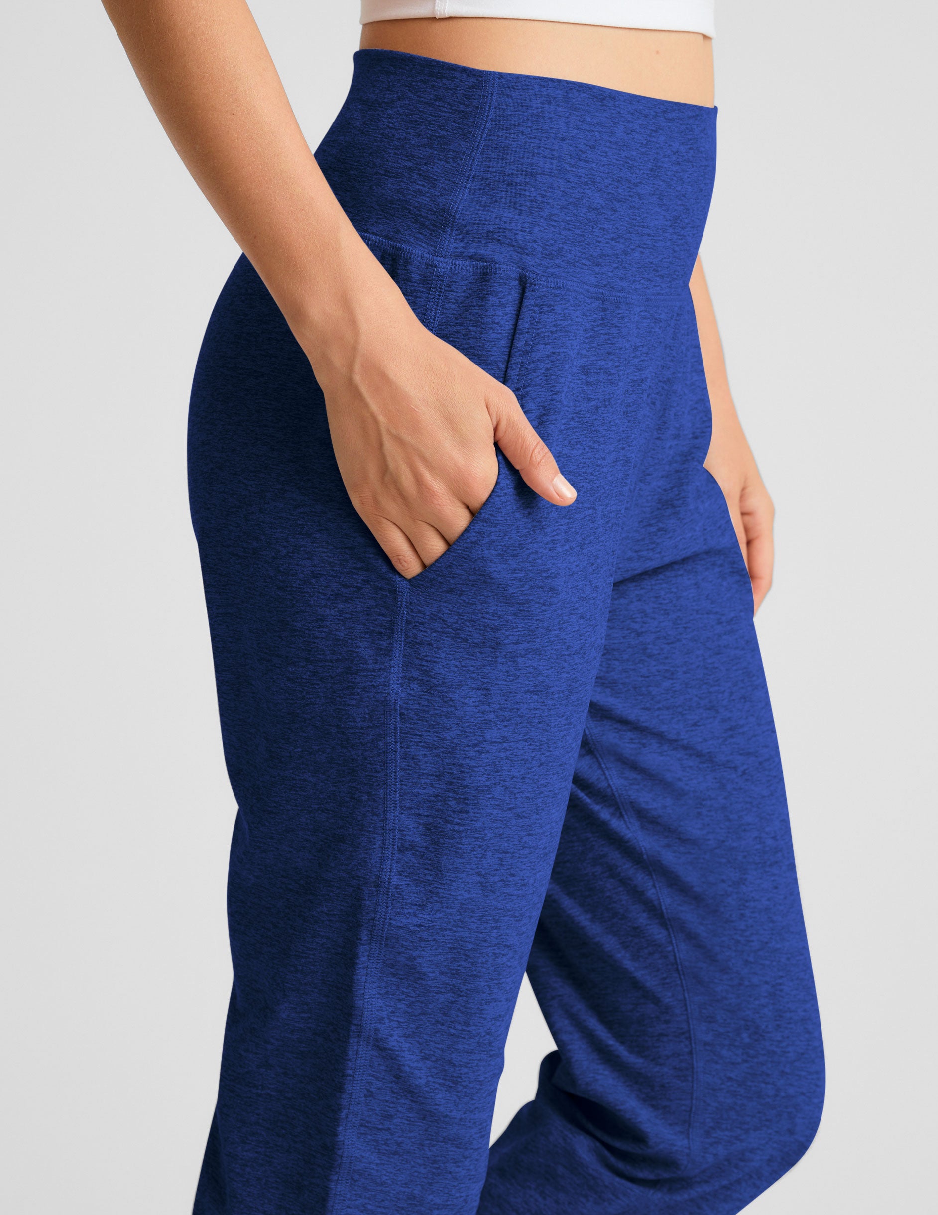 blue midi length joggers with side pockets. 