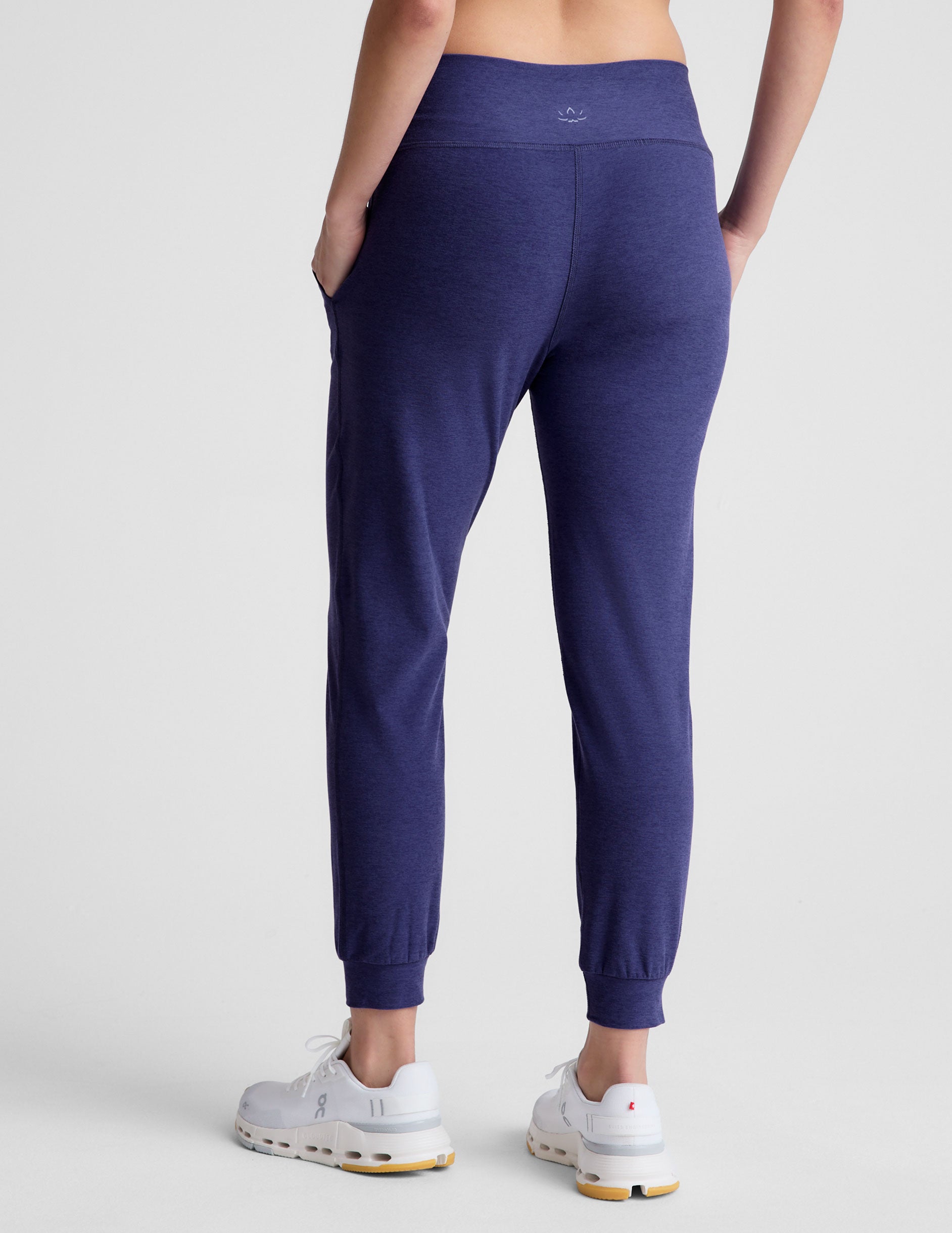 blue high-waisted midi length joggers with pockets. 