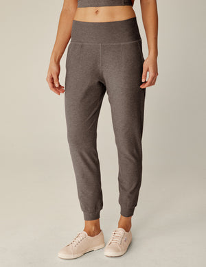 brown high-waisted midi length joggers with pockets. 