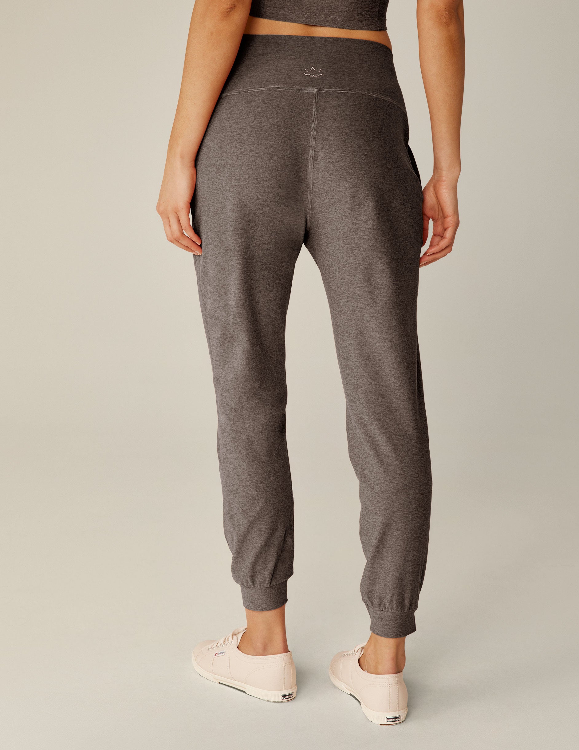 brown high-waisted midi length joggers with pockets. 