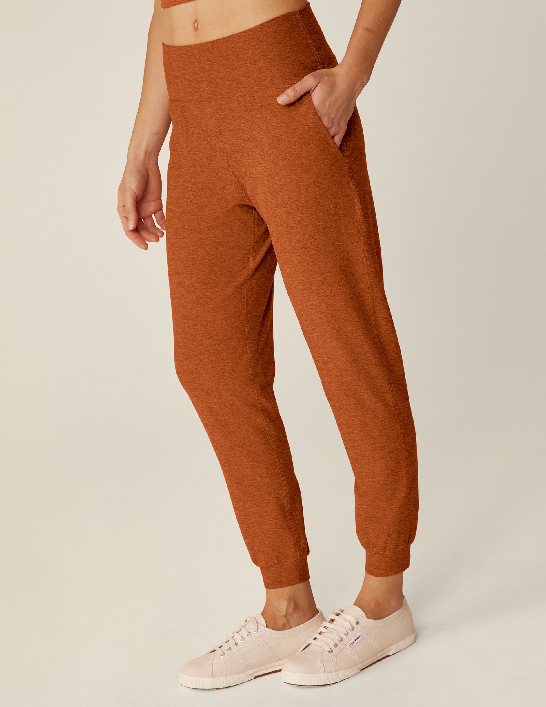 brown high-waisted jogger pants with pockets. 