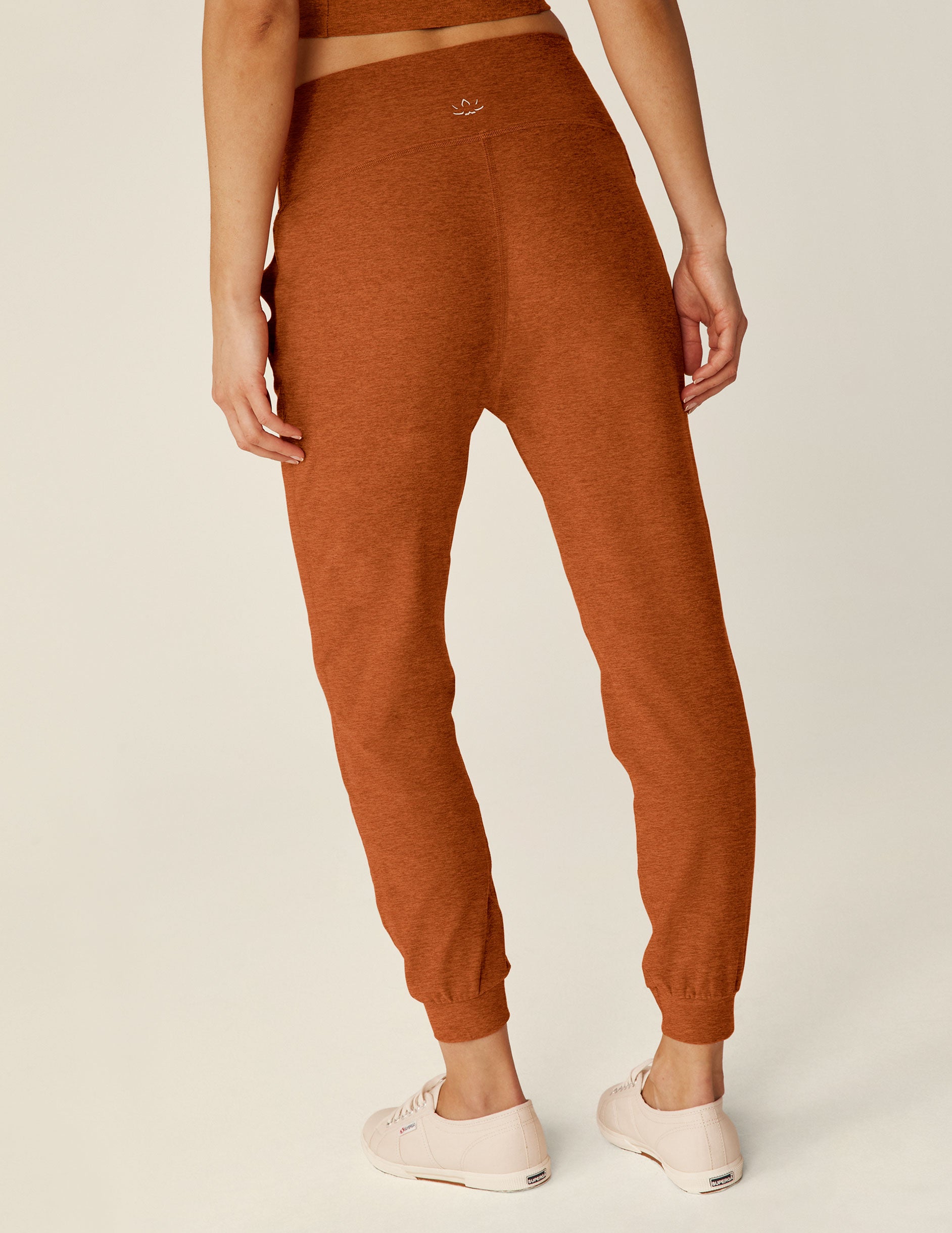 brown high-waisted jogger pants with pockets. 