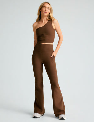 brown high-waisted flare pants with side pockets. 