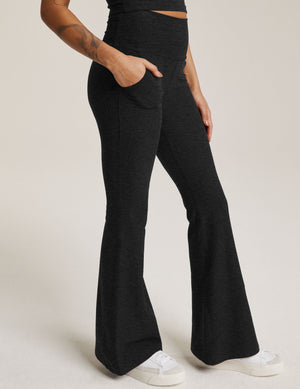 Side view of the marled black Spacedye All Day Flare High Waisted Pant with a high waistband, pockets, and flared leg.