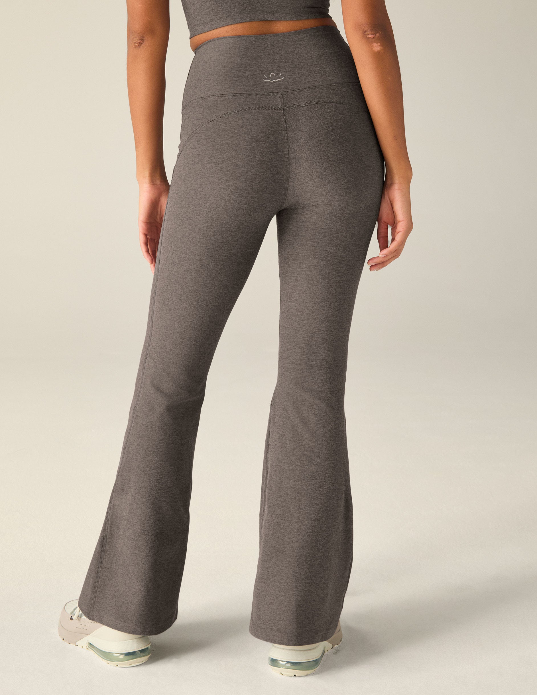 brown high-waisted flare pants with pockets. 