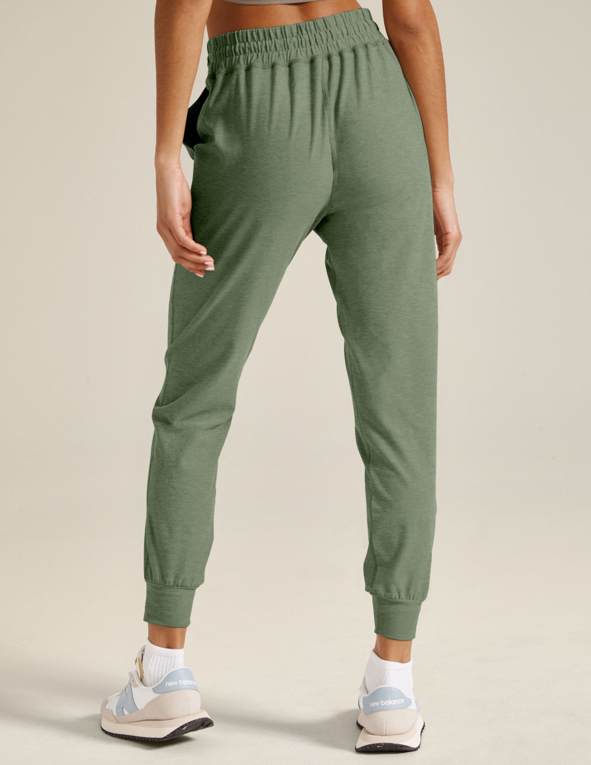 green midi jogger pants with a drawstring at waistband.