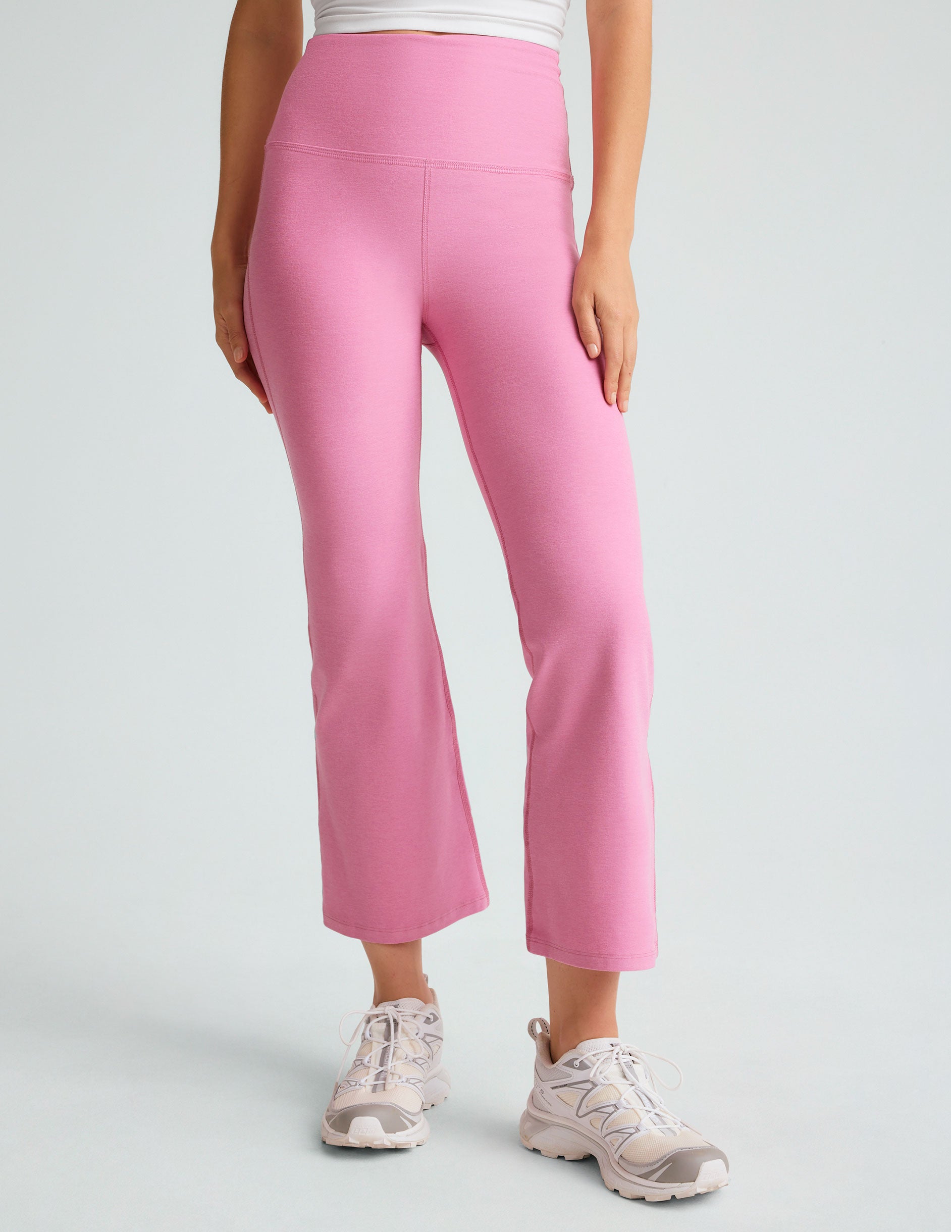 model is wearing pink high-waisted high-rise pants. 