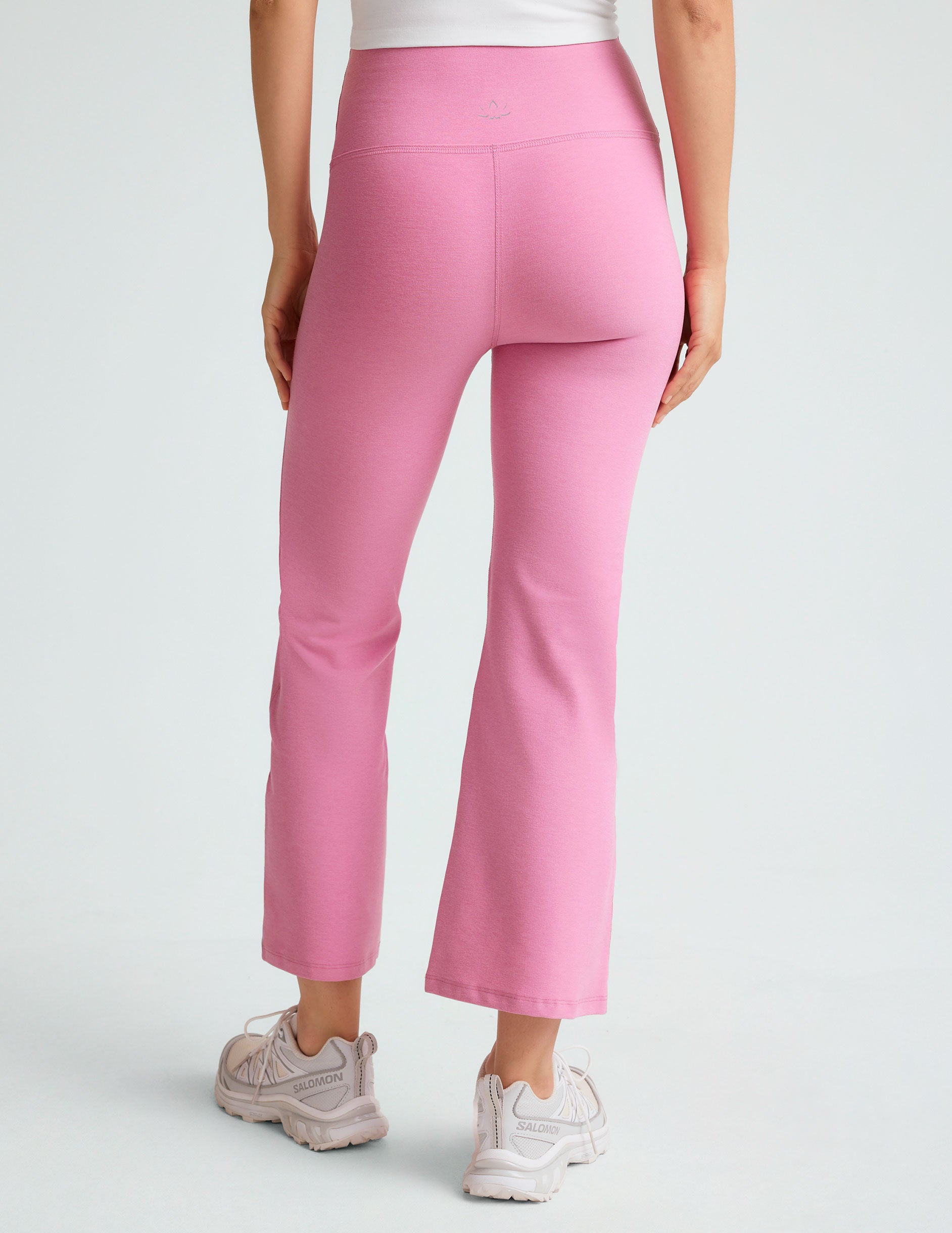 model is wearing pink high-waisted high-rise pants. 