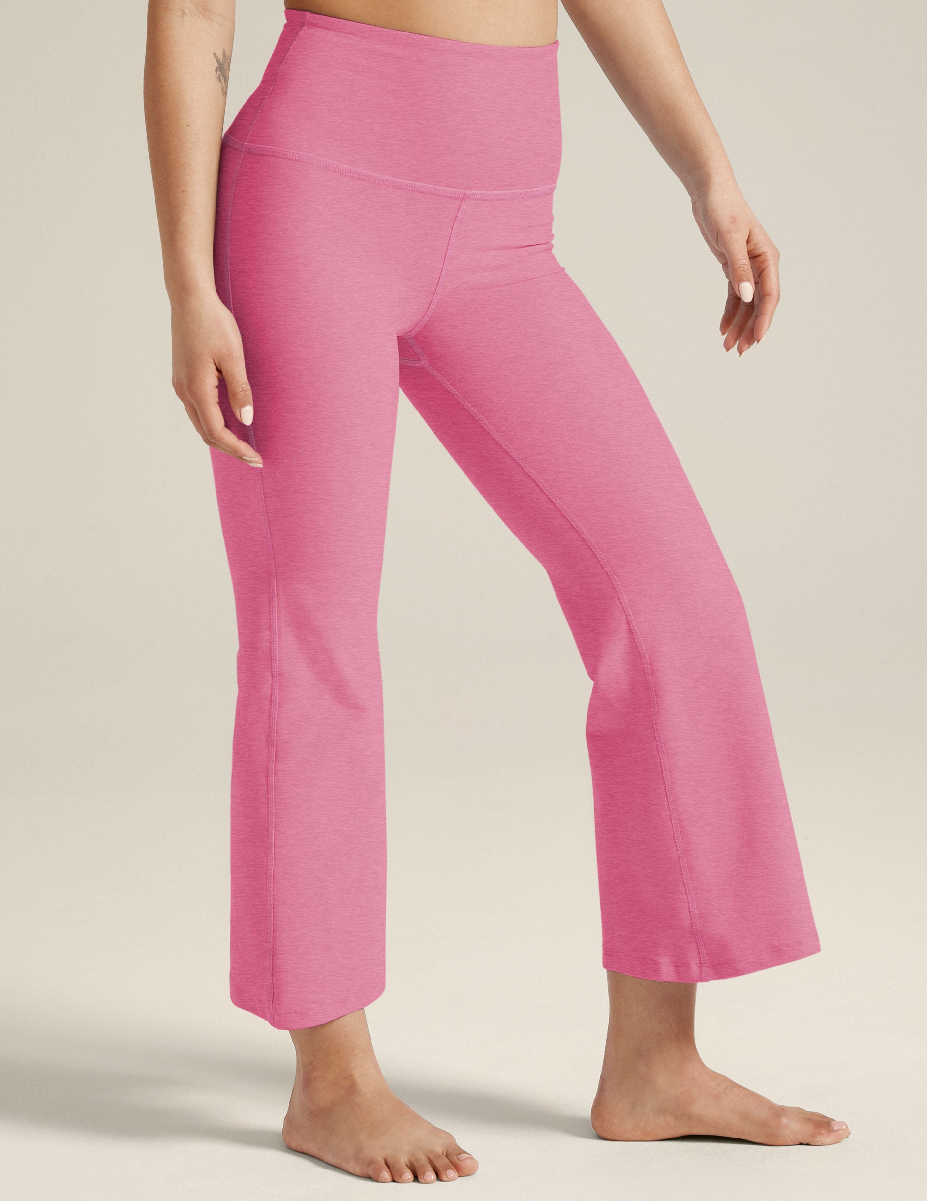 model is wearing pink high-waisted high-rise pants. 