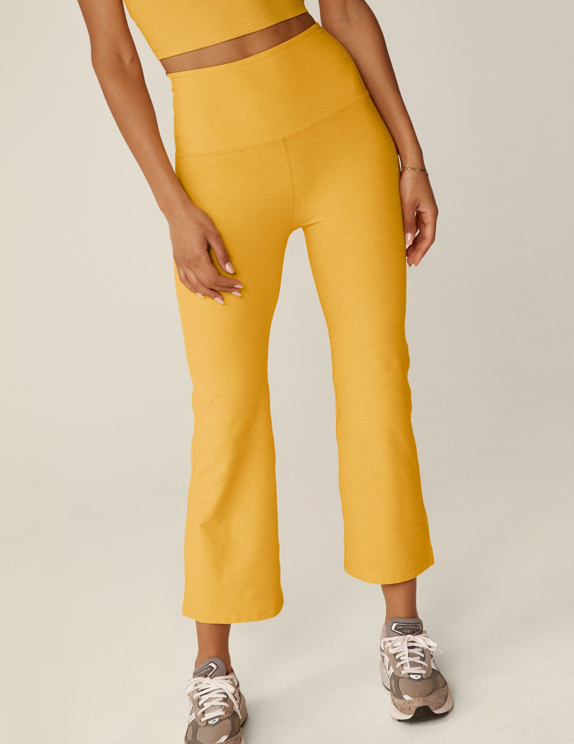 yellow high-waisted cropped flare spacedye pants. 