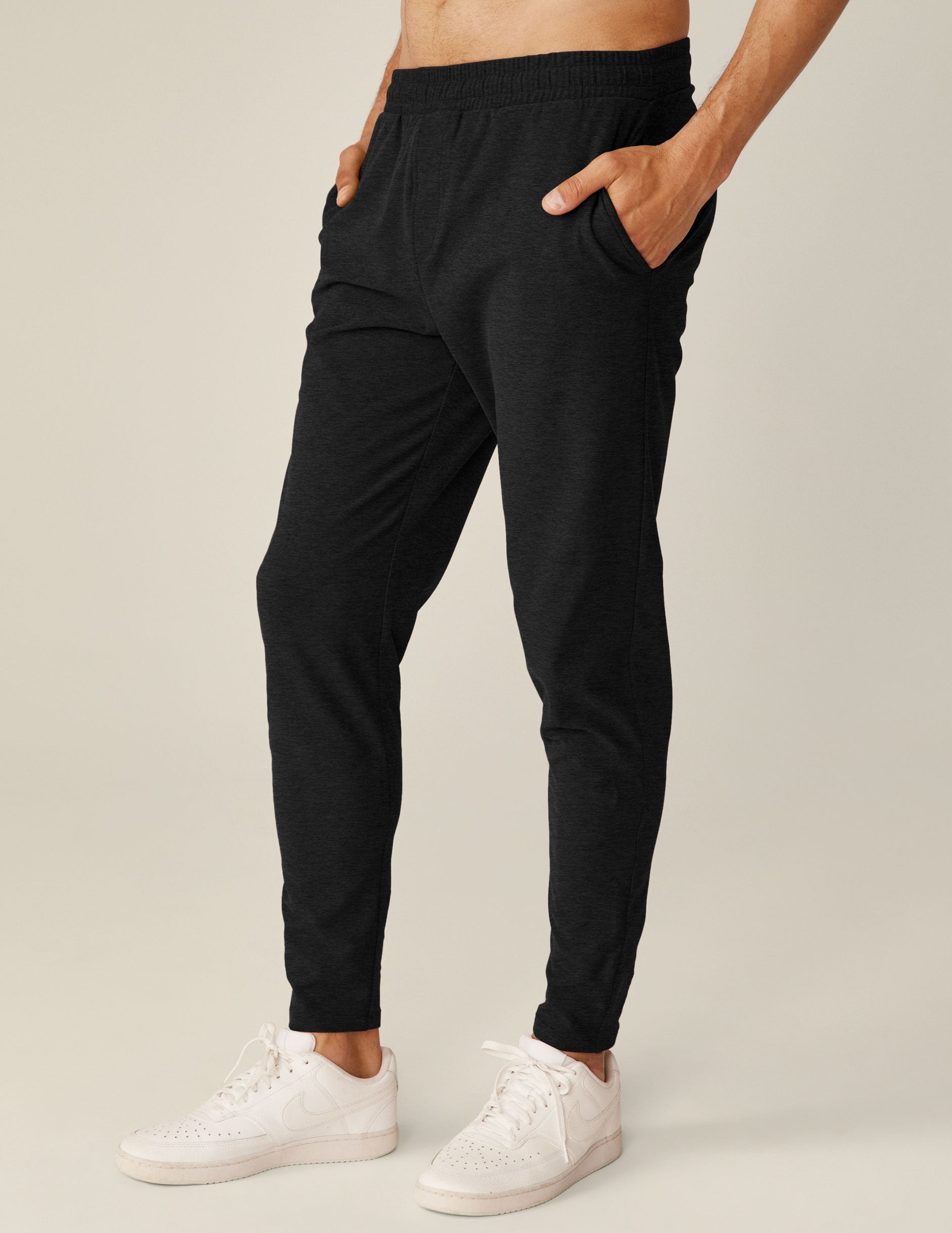 black men's athleisure pants with an internal drawcord and pockets. 