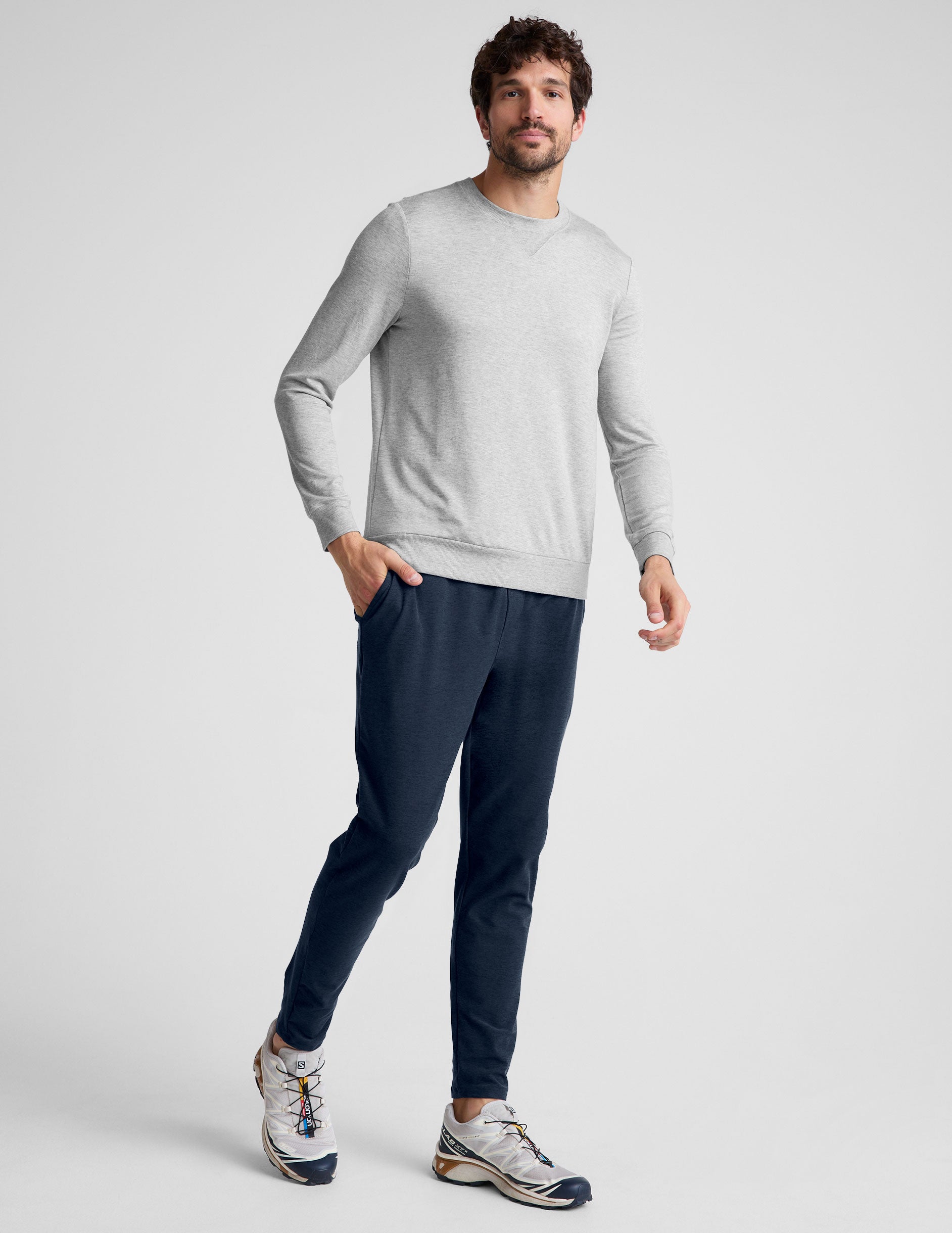 blue men's athleisure pants with an internal drawcord and pockets.