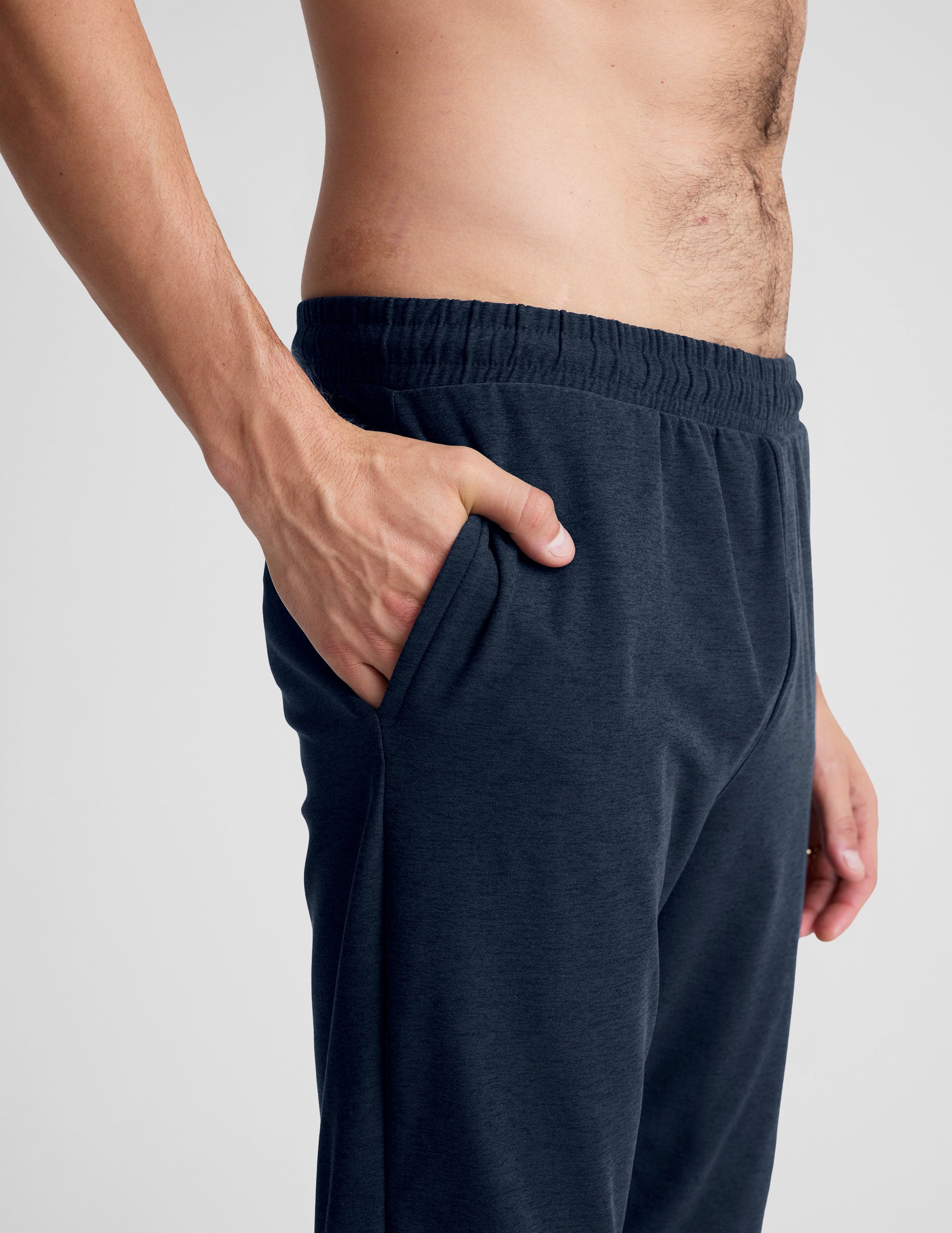 blue men's athleisure pants with an internal drawcord and pockets.