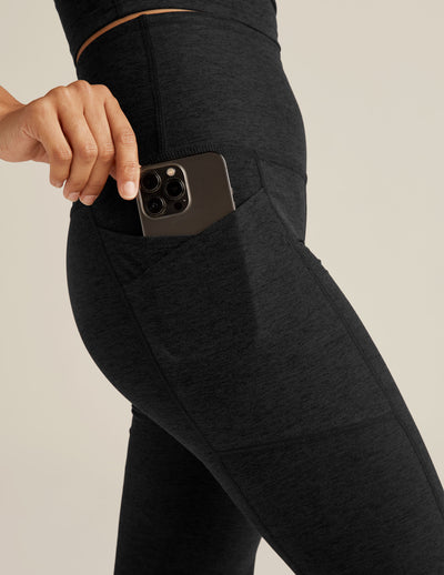 black high-waisted flare leggings with front side pockets. 