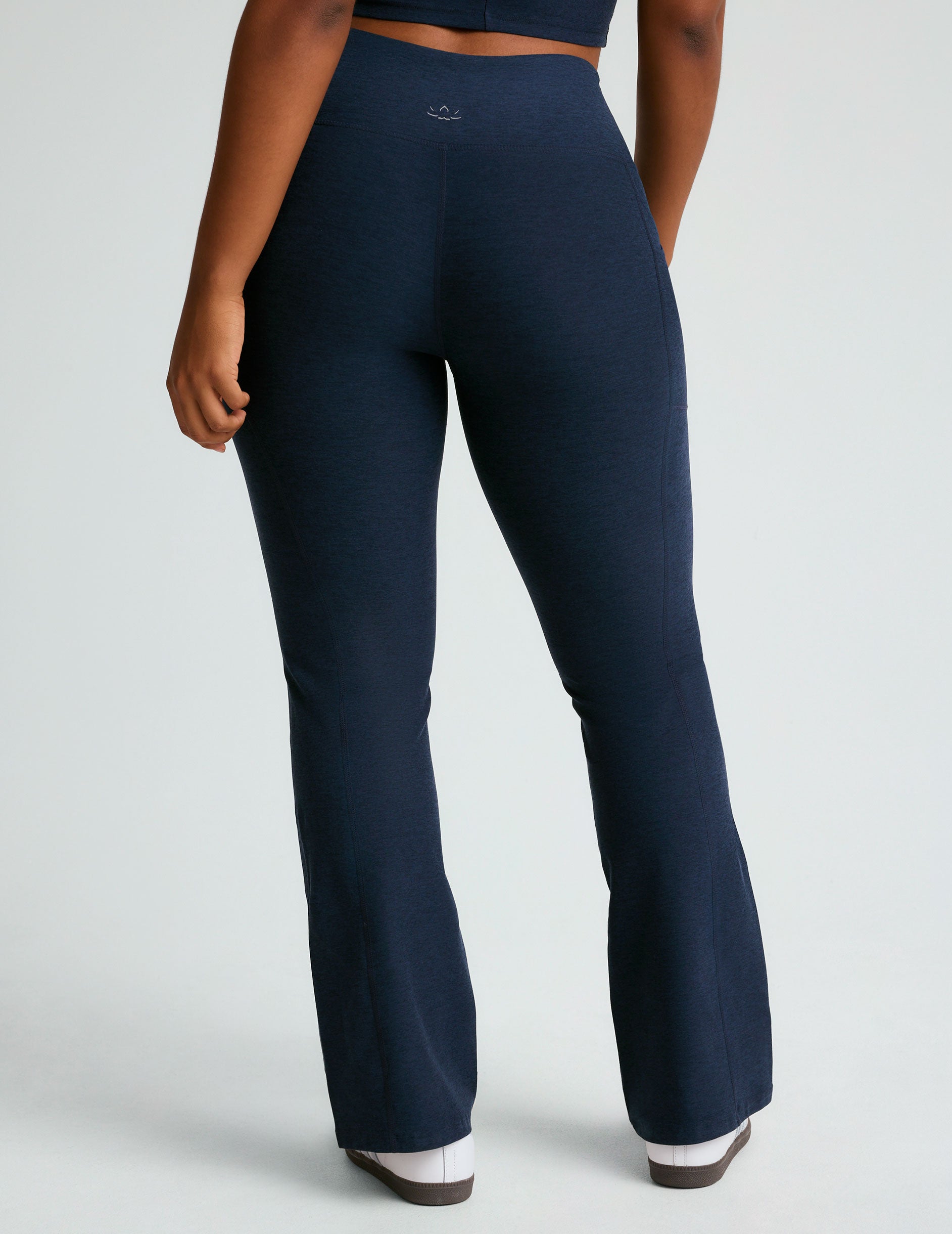 blue high-waisted bootcut leggings with front side pockets. 