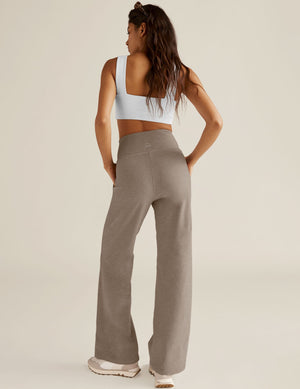 Rear view of Spacedye Laid Back Pant in beige marled fabric, featuring a high waistband, wide legs, and side pockets.