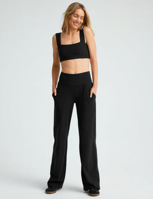 Spacedye Laid Back Wide Leg Pant Short in black on a model with hands in pockets, featuring a high waist and relaxed fit.