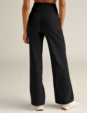 Back view of the marled black Spacedye Laid Back Pant showing the high waistband and full-length relaxed wide leg fit.