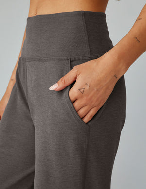 Close-up of the Spacedye Laid Back Wide Leg Pant in charcoal gray, featuring a high waistband and hand in a side slant pocket.