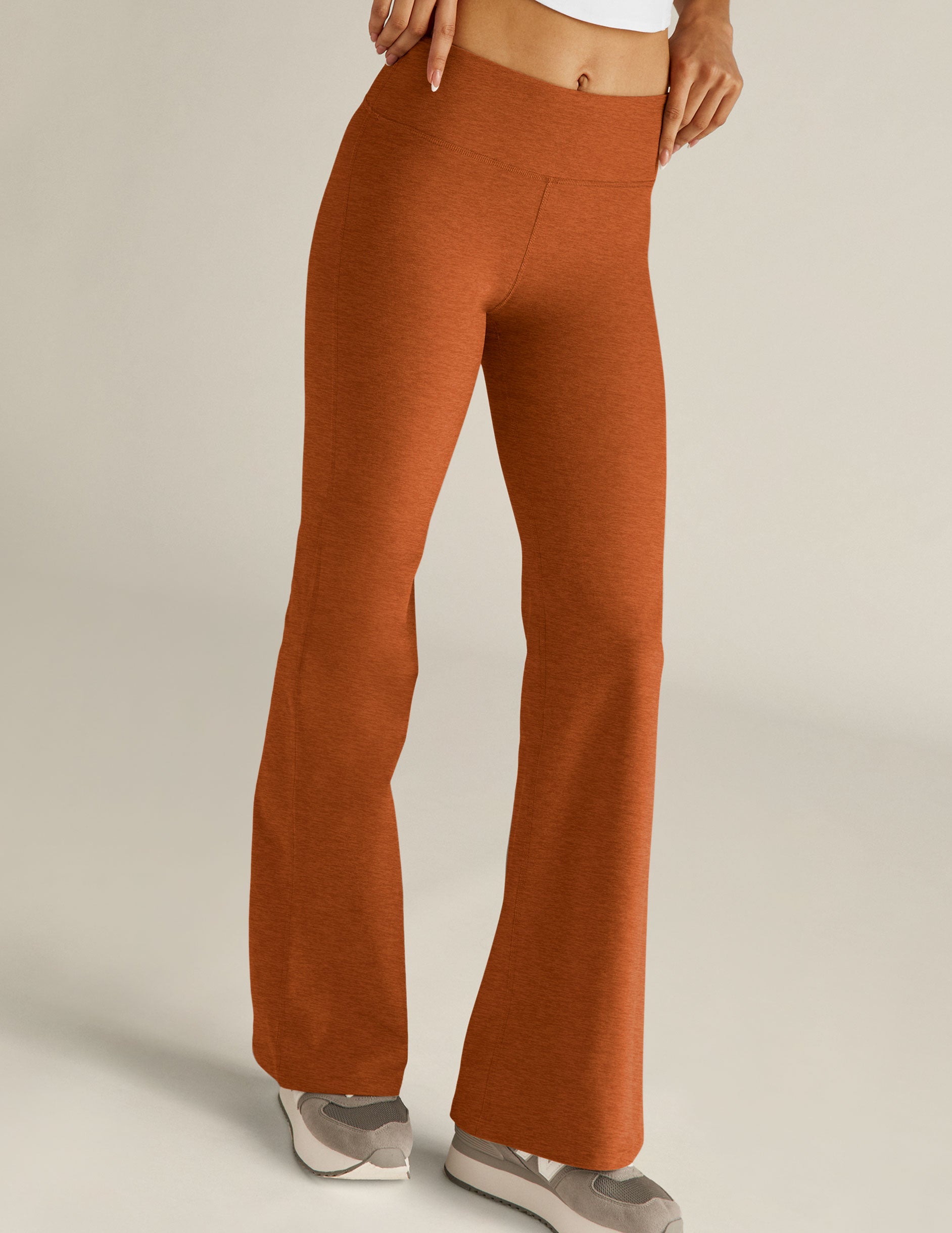 brown low-waisted flare pants. 
