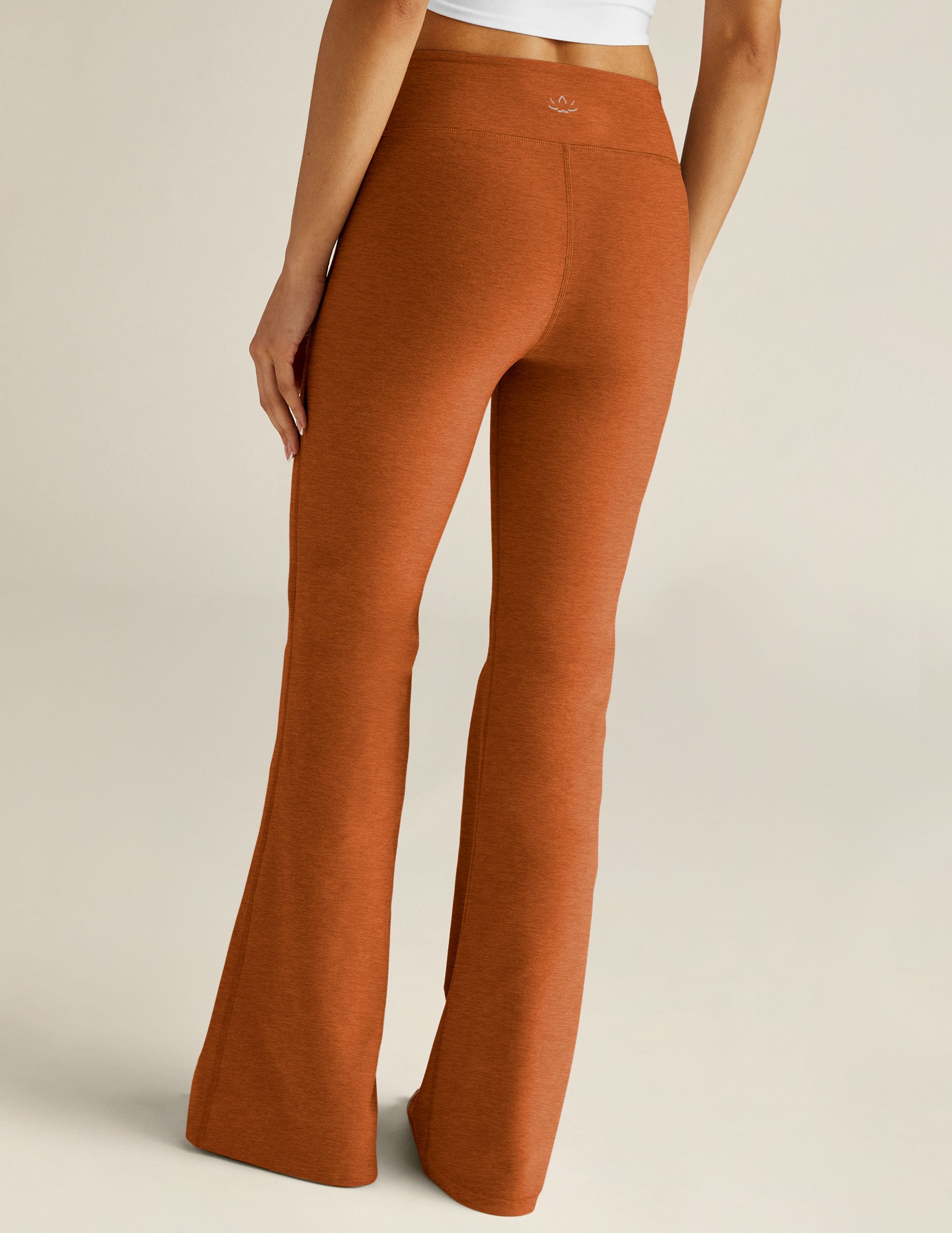 brown low-waisted flare pants. 