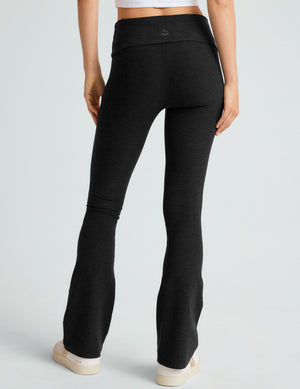 Rear view of Spacedye Foldover Bootcut Pant in black, showing the high waistband and fitted legs with a flared hem.