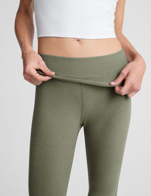 green bootcut pants with a foldover waistband. 