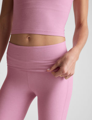 pink bootcut pants with a foldover waistband. 