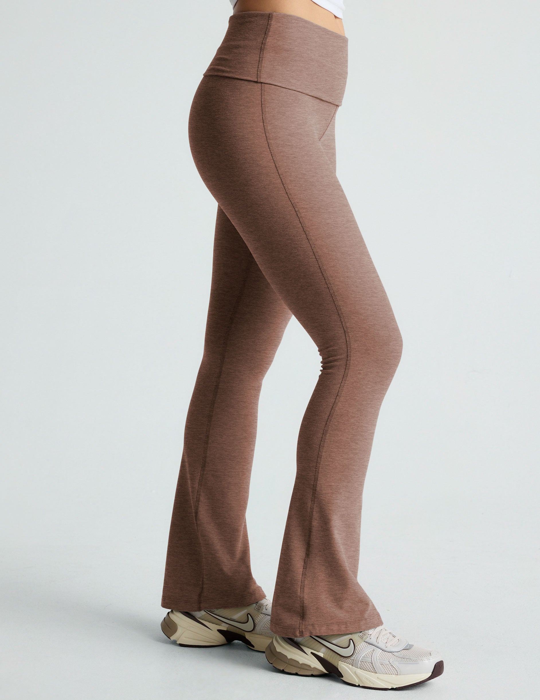 brown high-waisted bootcut flare leggings with a foldover waistband. 