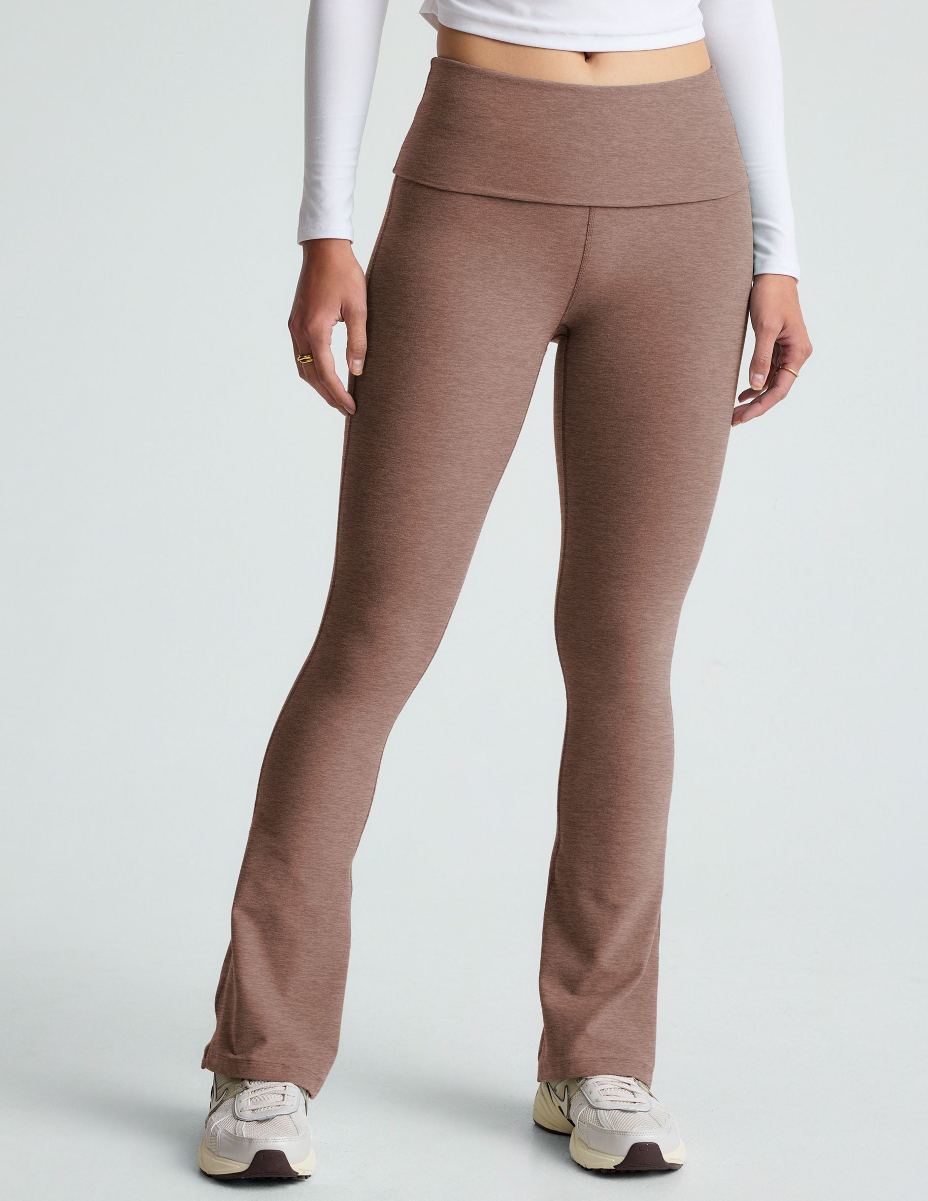 brown high-waisted bootcut flare leggings with a foldover waistband. 