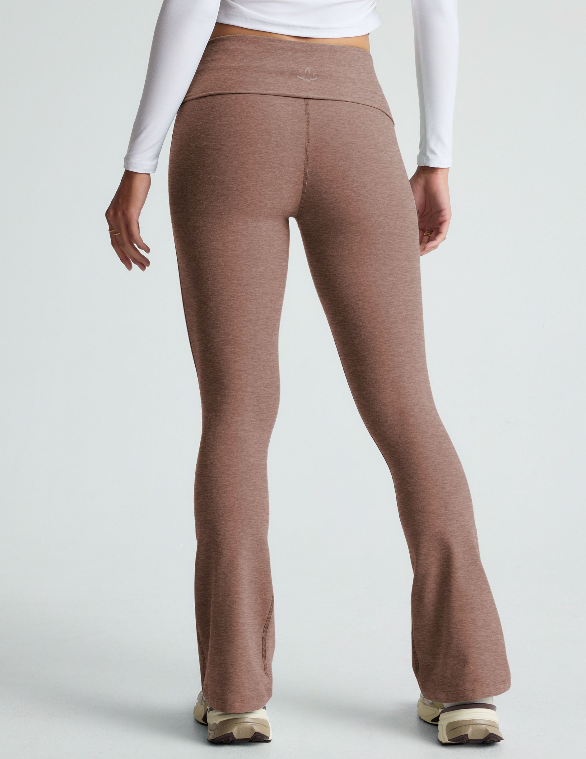 brown high-waisted bootcut flare leggings with a foldover waistband. 