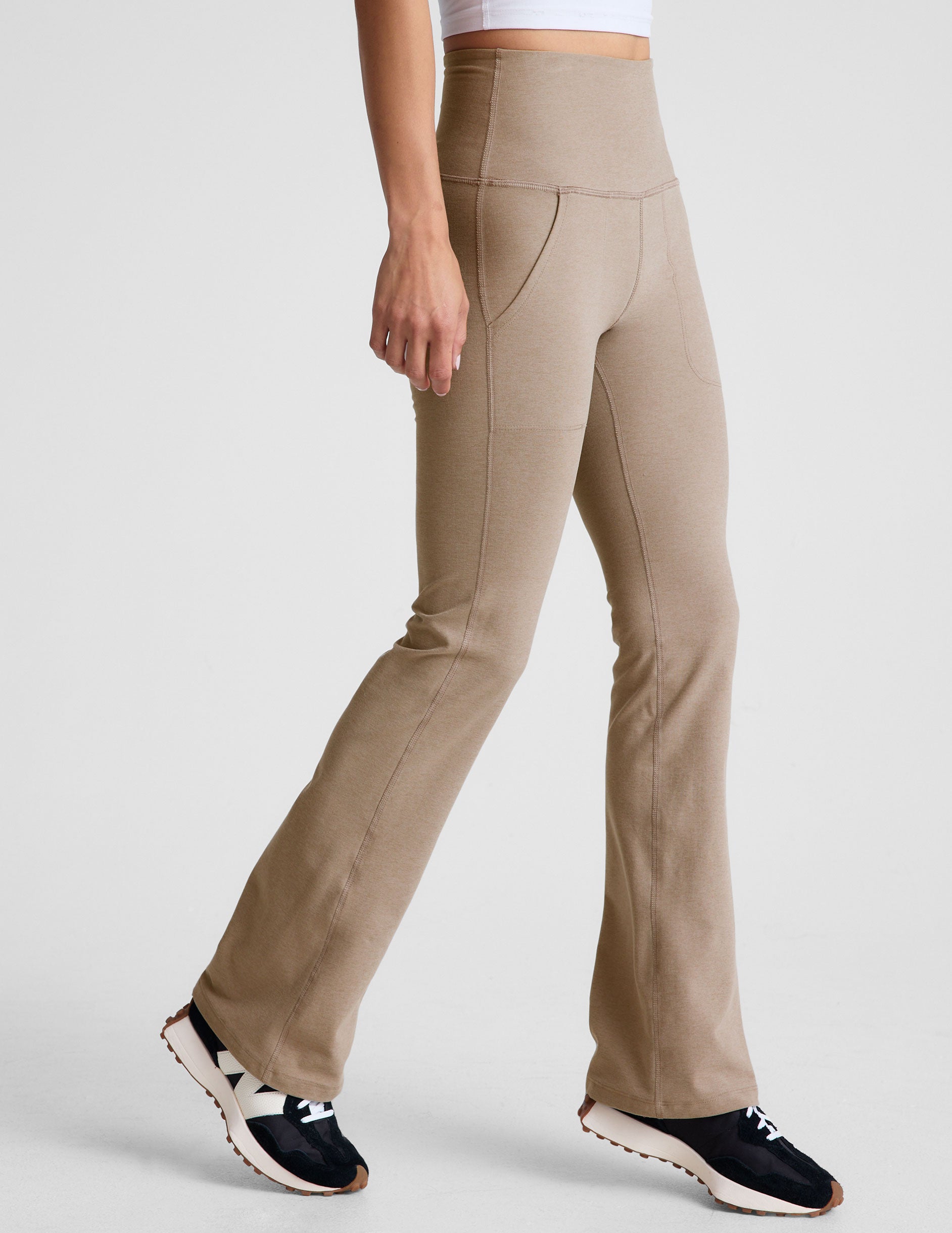 brown high-waisted bootcut pants with side pockets. 