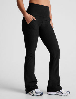 Spacedye High Waisted Practice Pocket Bootcut Pant in black, featuring side pockets and flared legs, worn by a model.