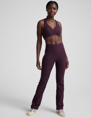 Spacedye High Waisted Practice Pocket Bootcut Pant in purple, shown on a model with a matching sports bra and side pockets.