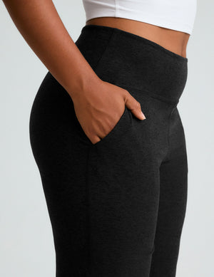 Side view of black marled Spacedye Foldover Wide Leg Pant with a hand in the front pocket and a high foldover waistband.