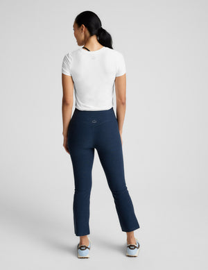 Rear view of the Navy Spacedye Pintuck Kick Flare High Waisted Pant featuring a snug fit and cropped flared legs.
