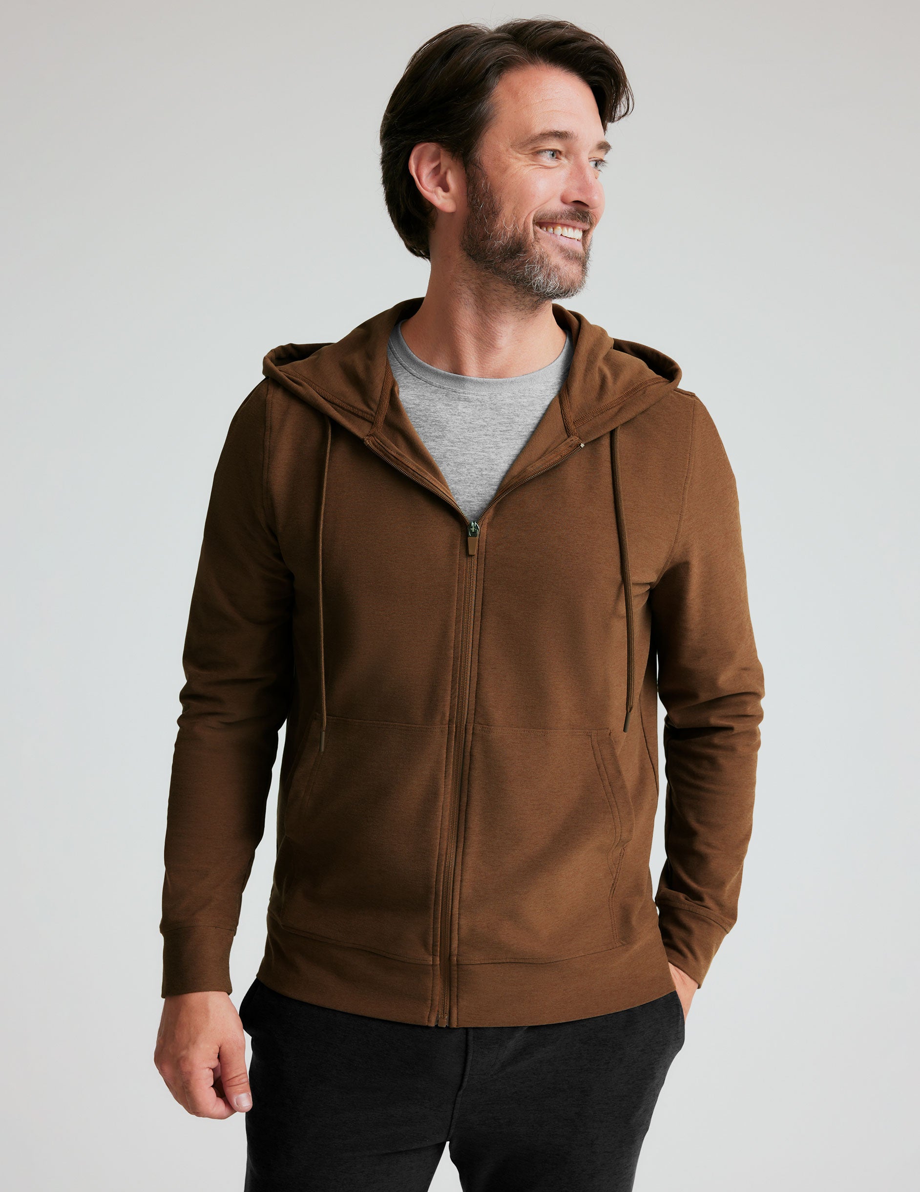 brown men's zip-up jacket with a hood and pockets. 