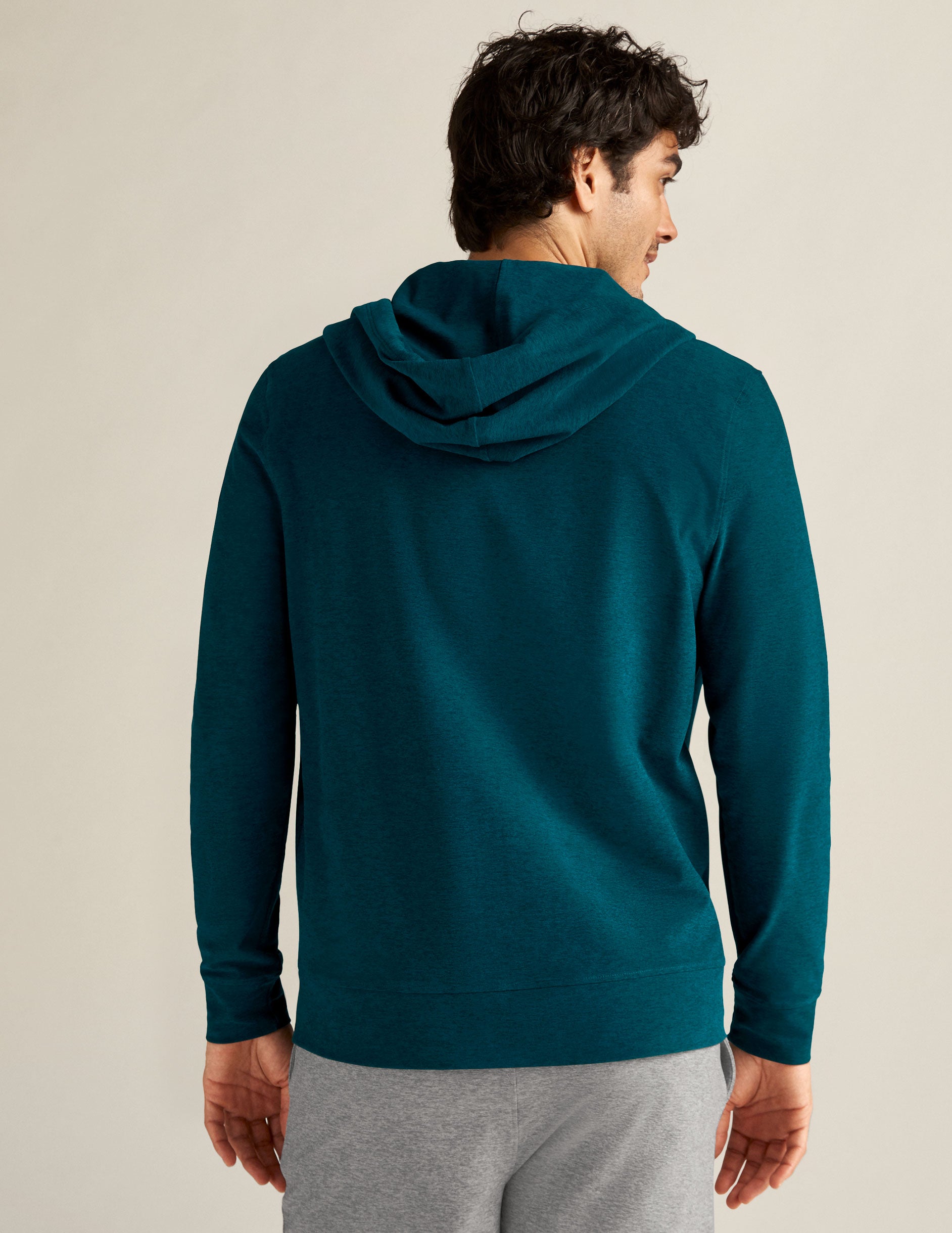 blue men's zip-up hooded jacket with side pockets. 