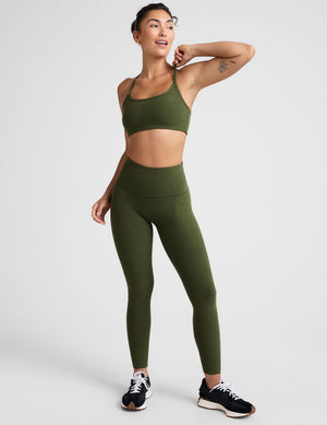 green high-waisted midi length leggings. 