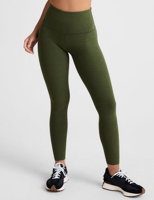 green high-waisted midi length leggings. 