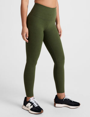 green high-waisted midi length leggings. 
