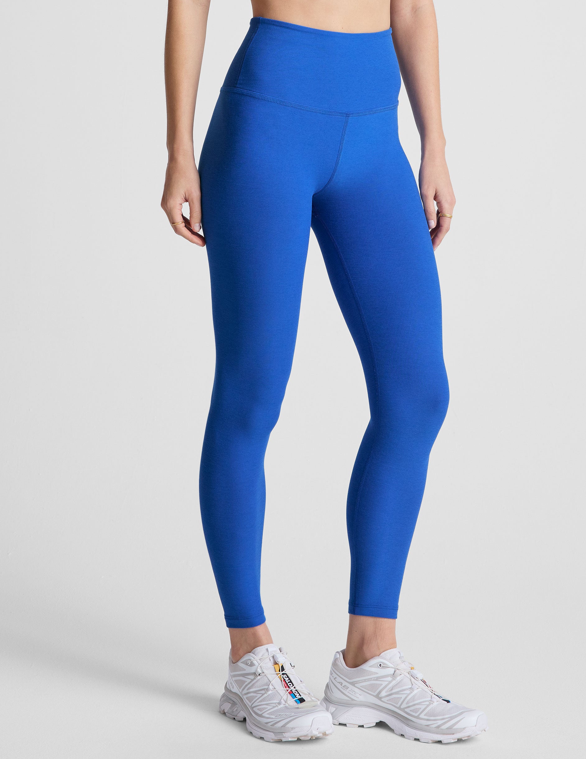 blue high-waisted midi length leggings with a 24" inseam and 5" rise waistband. 