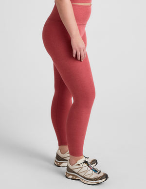 red high-waisted midi length leggings. 