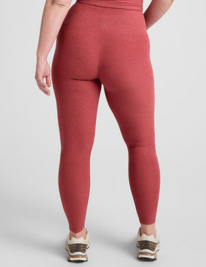 red high-waisted midi length leggings. 