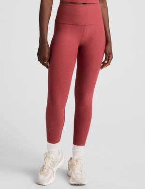 red high-waisted midi length leggings. 