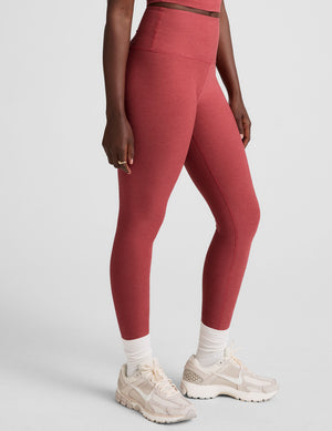 red high-waisted midi length leggings. 