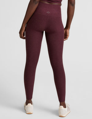 red high-waisted midi length leggings. 
